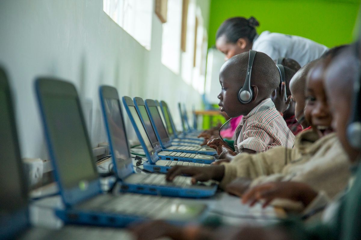 Young man learning digital skills at a desk