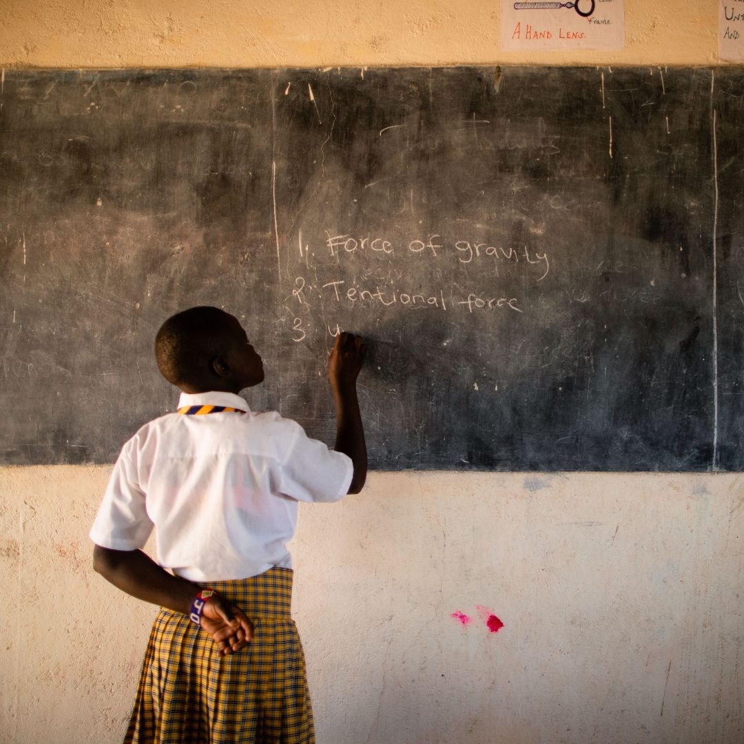 Smiling schoolboy in classroom